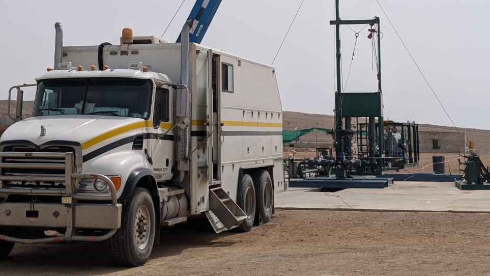 ETS slickline and wireline service truck fleet at the yard